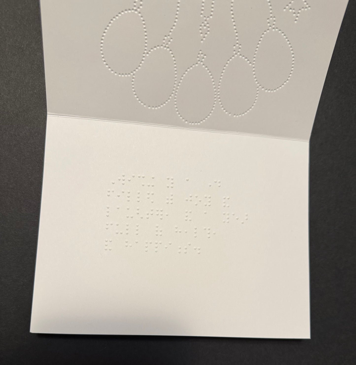 Braille birthday card with tactile cake and balloons