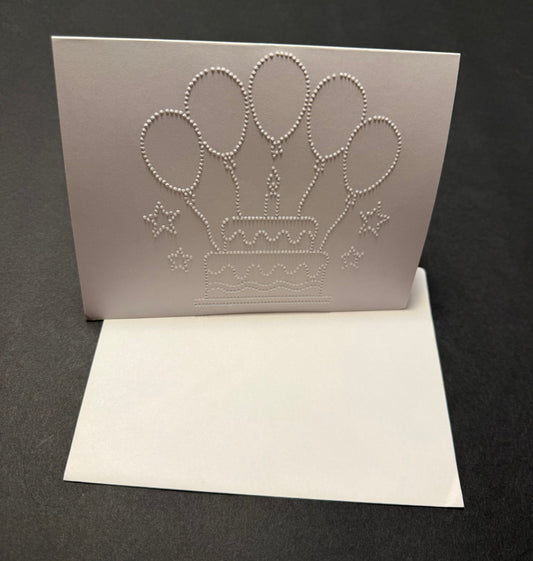 Braille birthday card with tactile cake and balloons